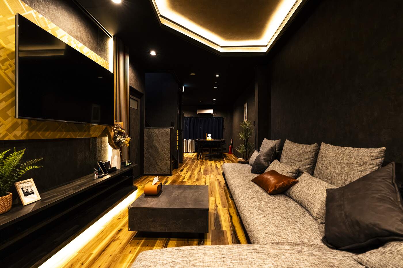 Second-floor living room with sofa and walnut floor